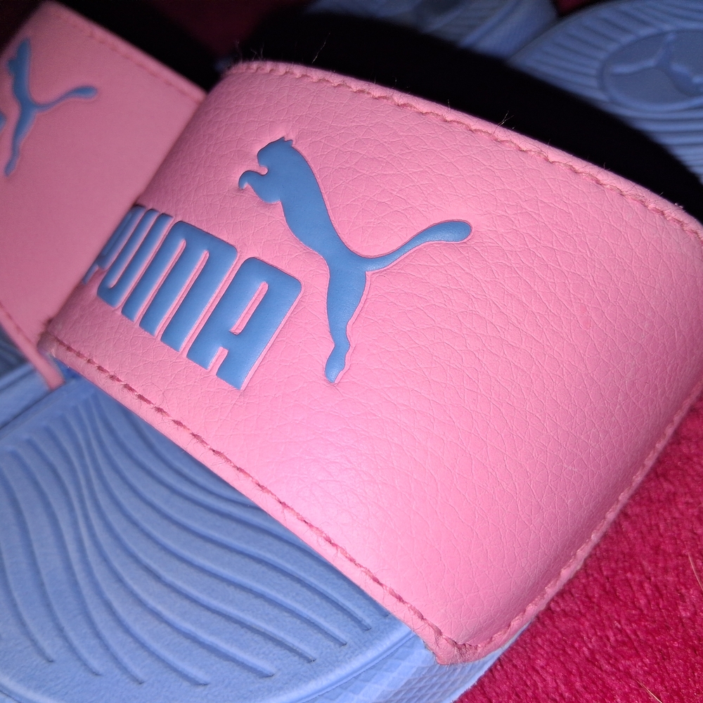 Puma Kids Pink and Blue Slide Sandals.